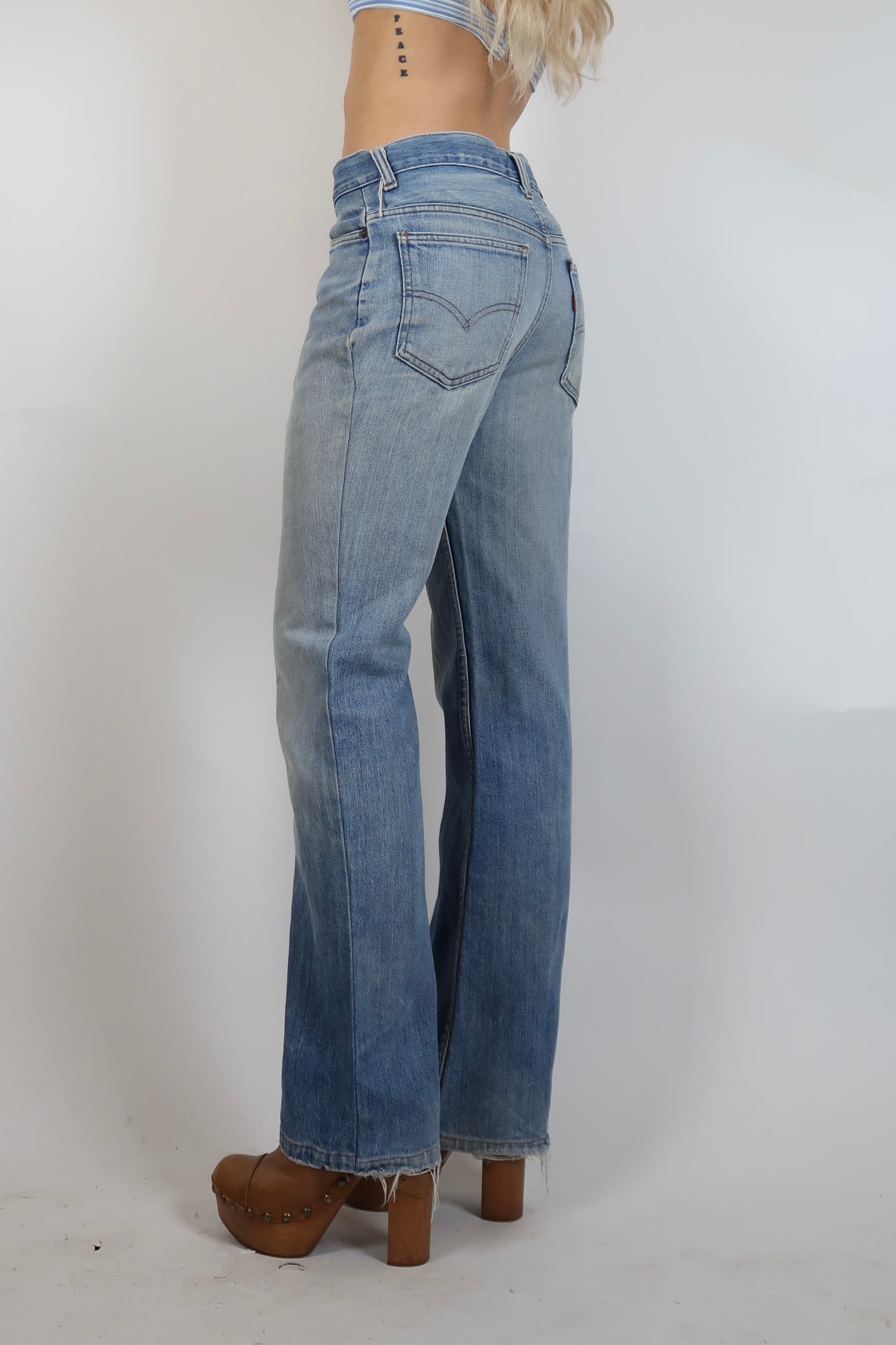 Early 1980s light wash orange tab Levi's jeans