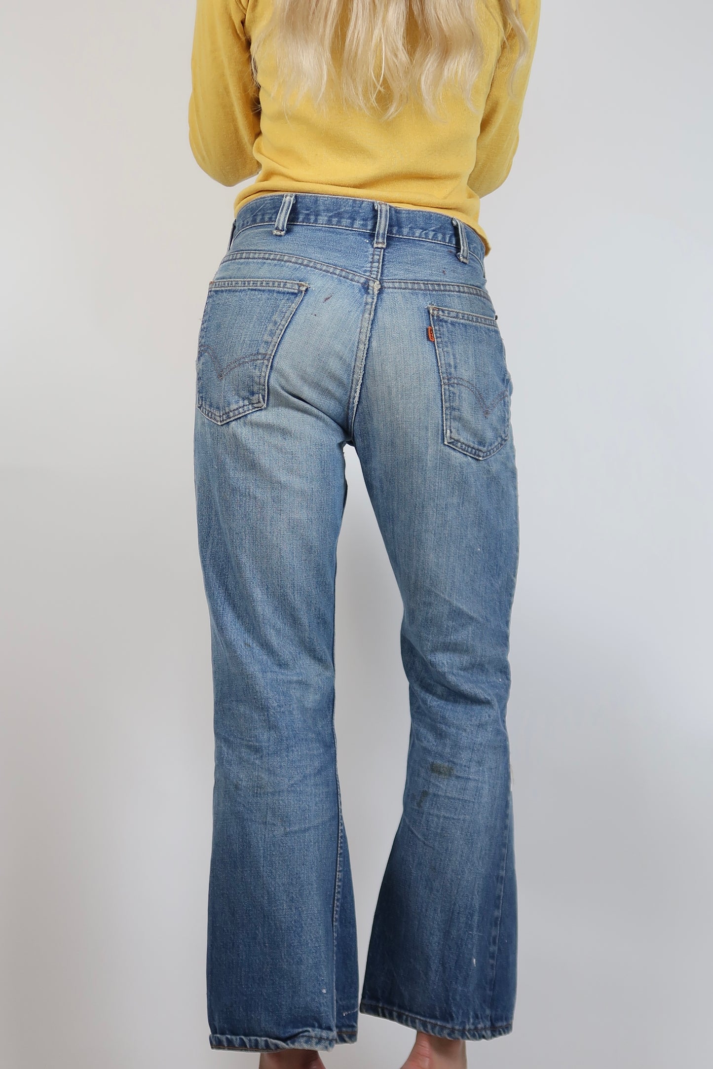 1970s Orange tab Levis with paint and and rips