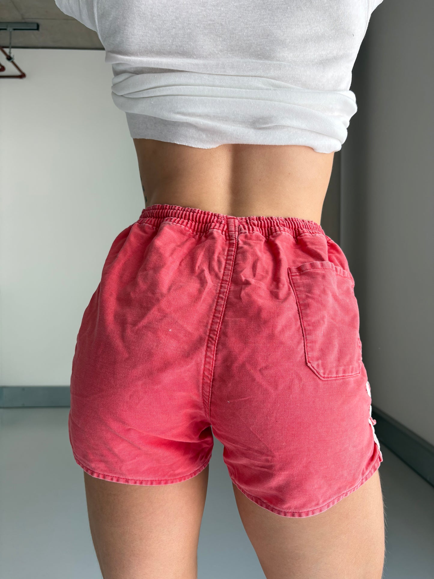 faded red sports shorts